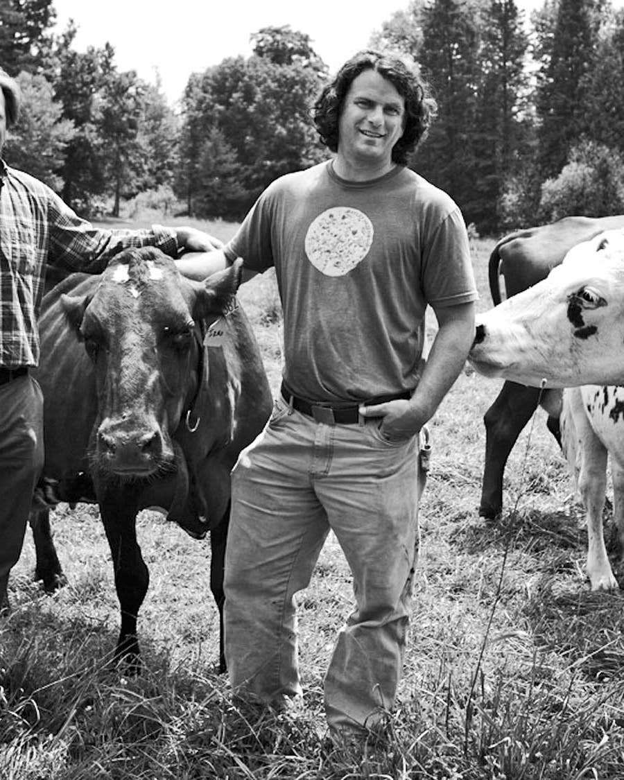 Andy (left) and Mateo Kehler pose with a few of their Ayrshire cows at Jasper Hill Farm in Greensboro, Vermont.
