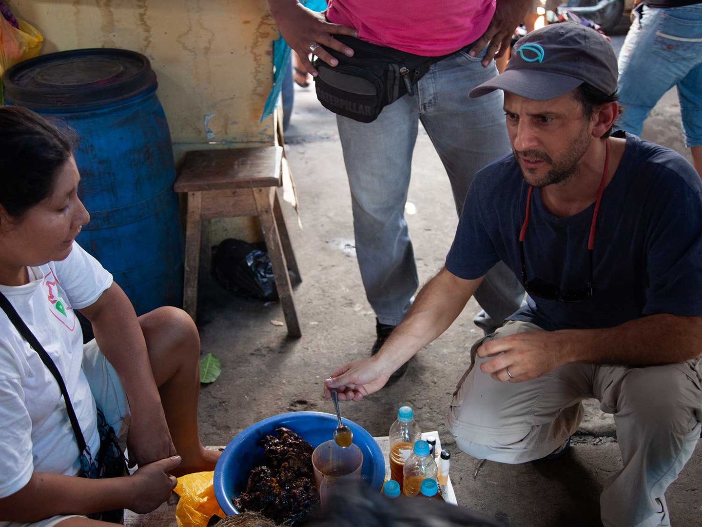 Peruvian chef Pedro Miguel Schiaffino speaks with a vendor at the Mercado de Belén in the Amazonian city of Iquitos.