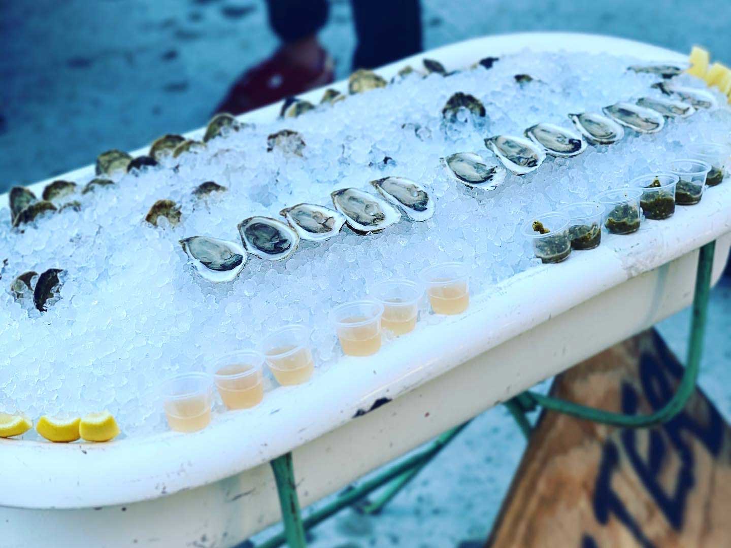 Oysters on ice in the “Car George” tub offered by Charleston restaurant, Bar George. Accompaniments include mignonette and caviar.