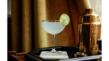 Classic Gin Gimlet with golden cocktail shaker