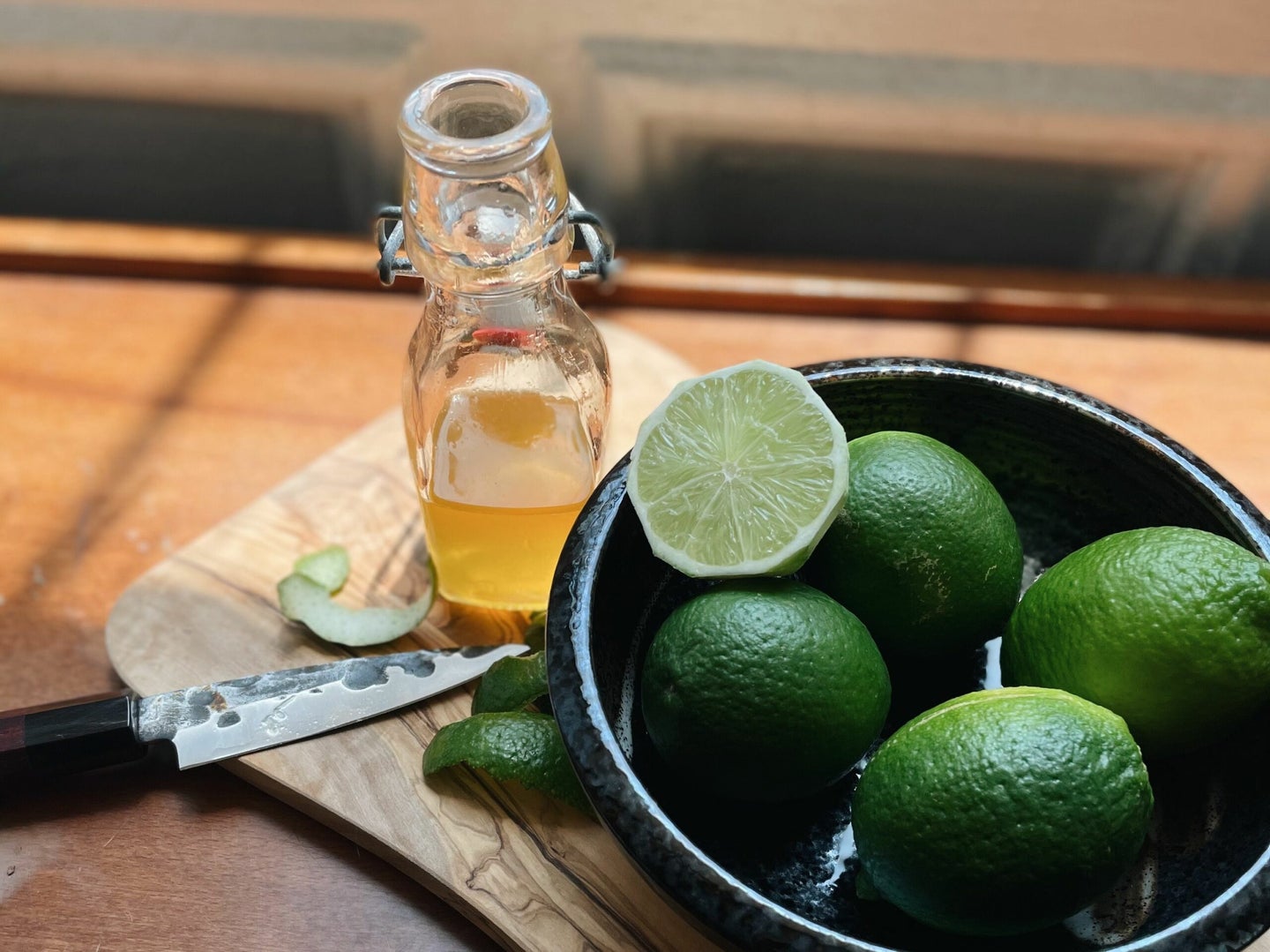 Lime Cordial Céline Bossart with Limes in Bowl