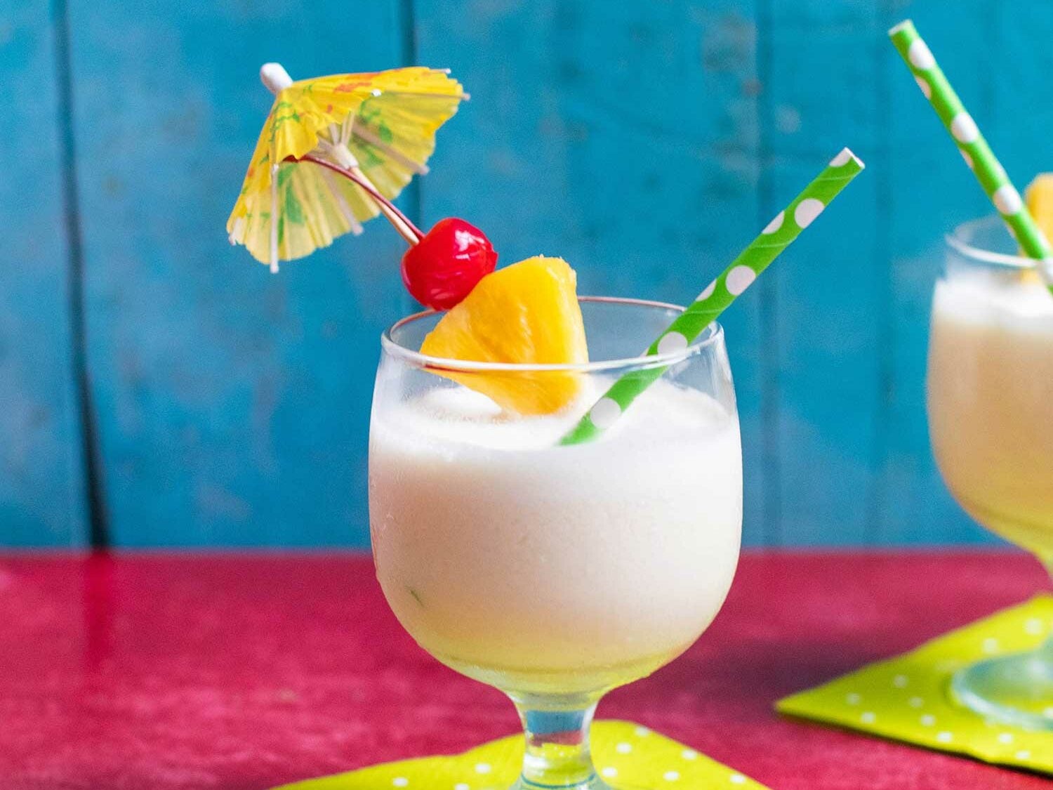 Frozen pina colada with umbrella and cherry on top