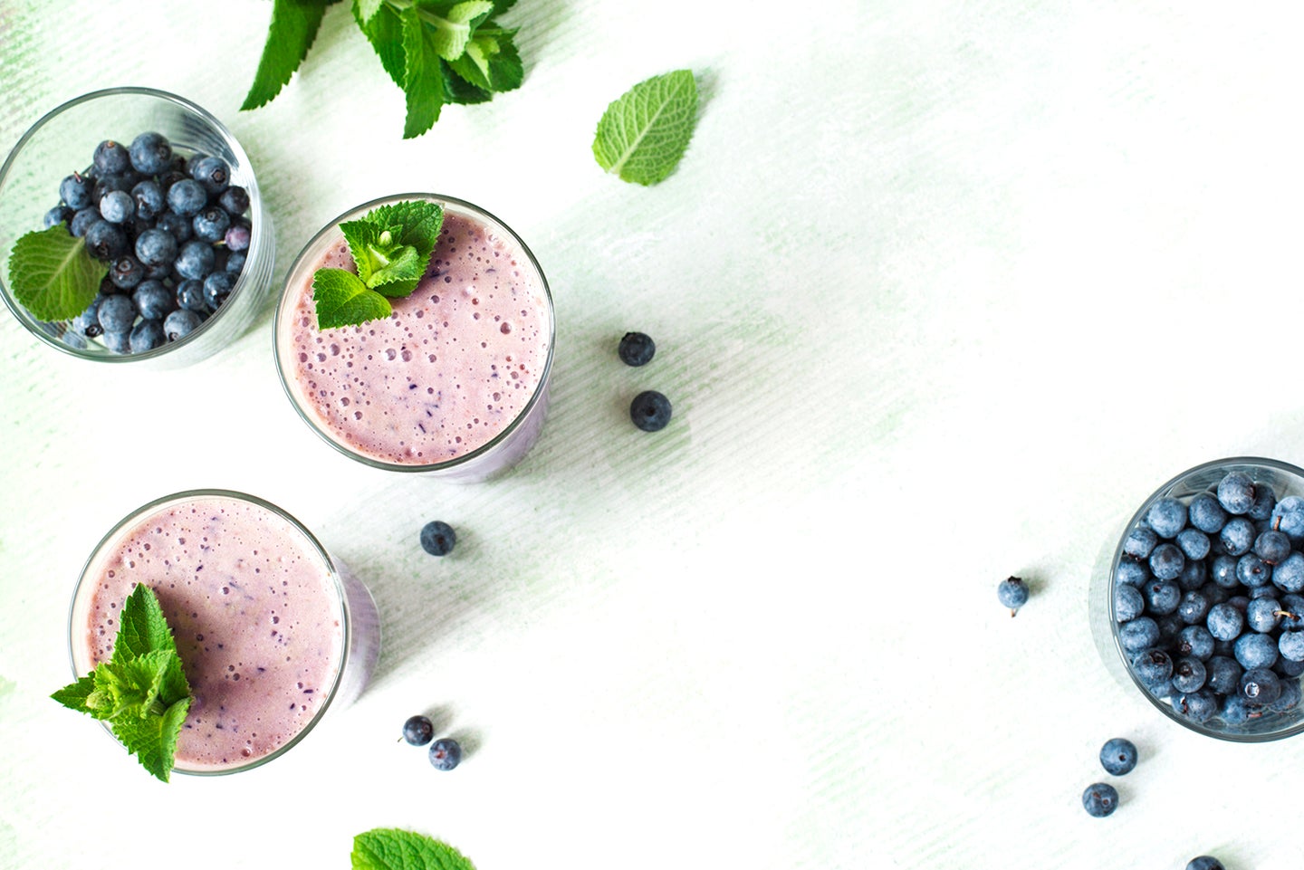 Two Glasses of blueberry milkshake. Top view