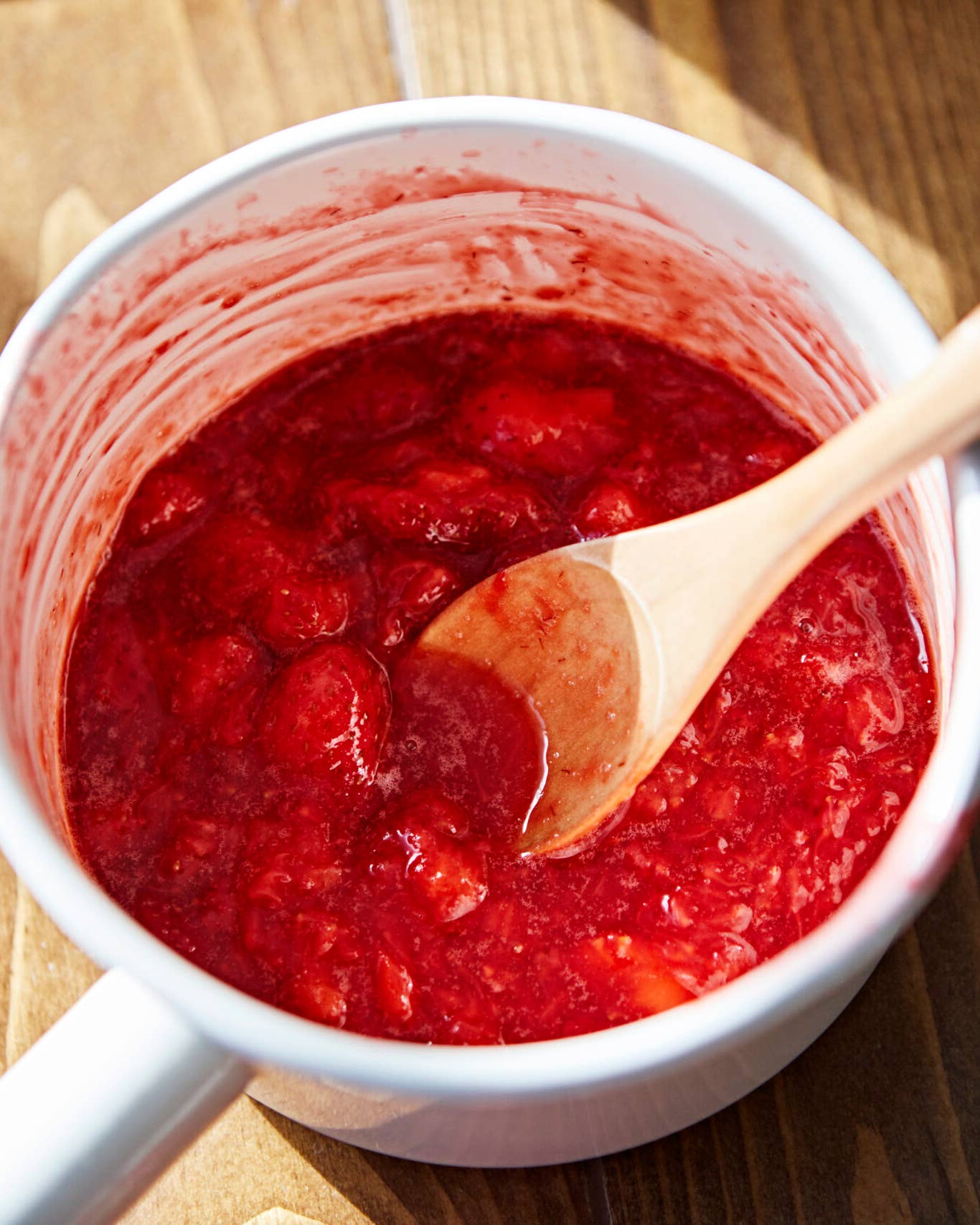 Fresh strawberry jam in a pot