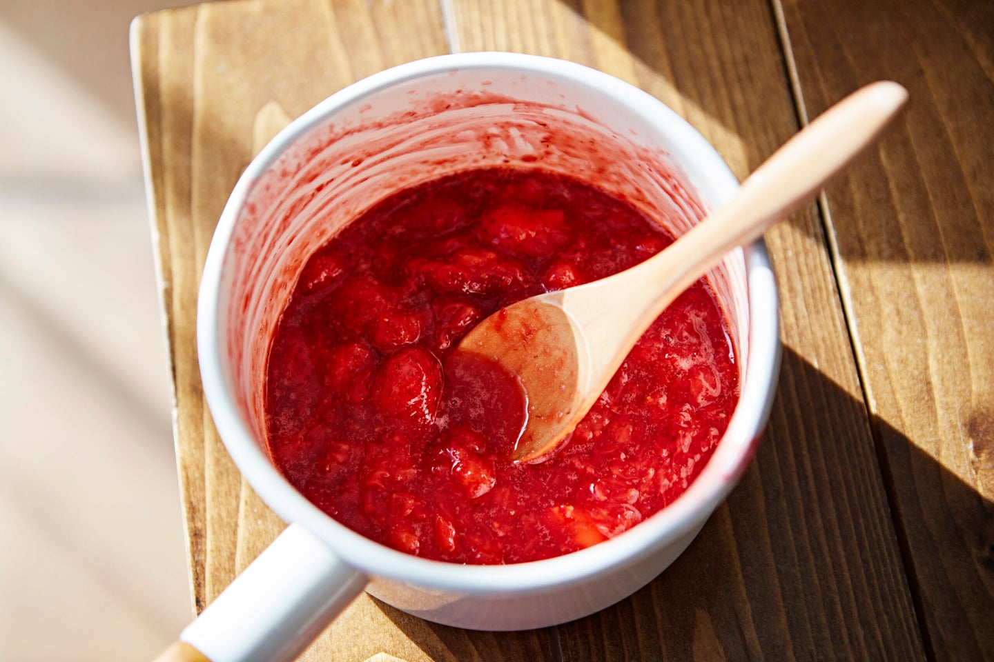 Fresh strawberry jam in a pot