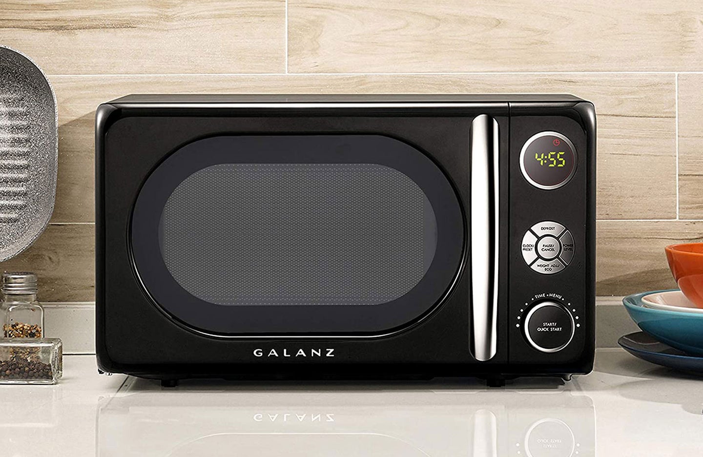 black microwave on kitchen countertop