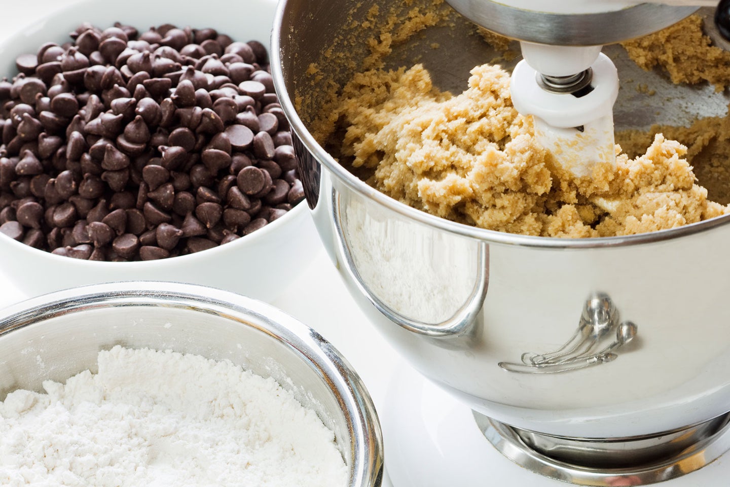 bowl of cookie dough with bowl of chocolate chips