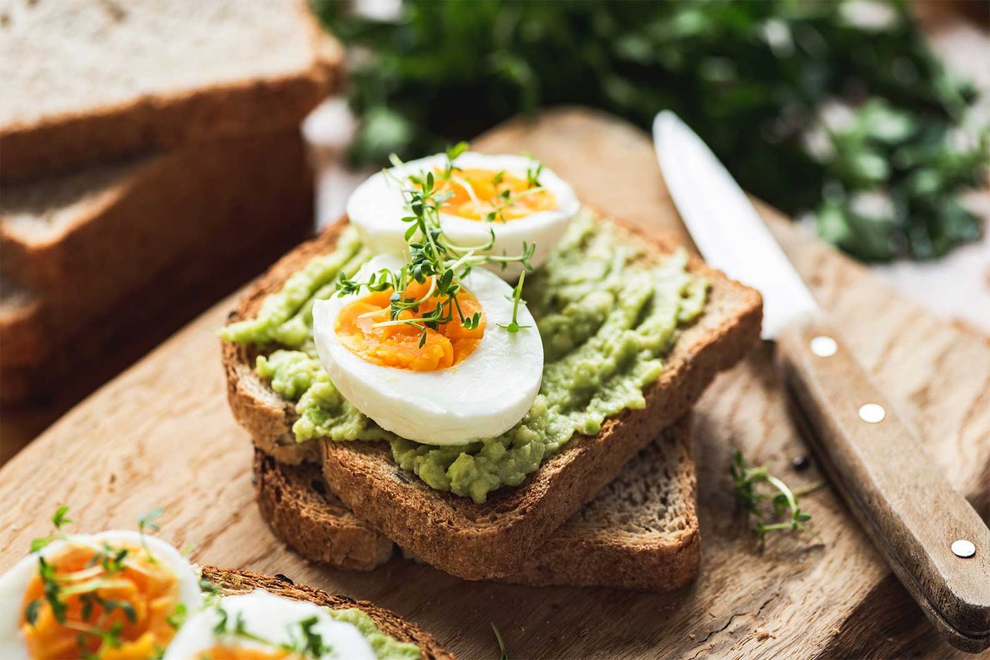 acocado toast with a soft boiled egg