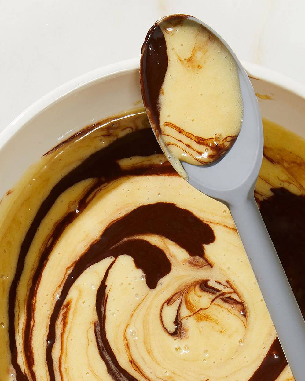 Vanilla and chocolate cake batter swirled together