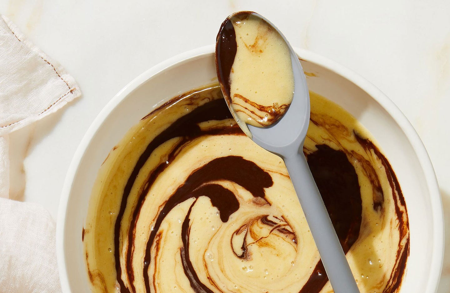Vanilla and chocolate cake batter swirled together