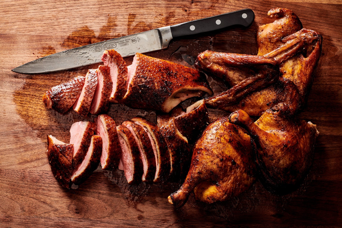 Winco Carving Knife on Wood Cutting Board with Meat