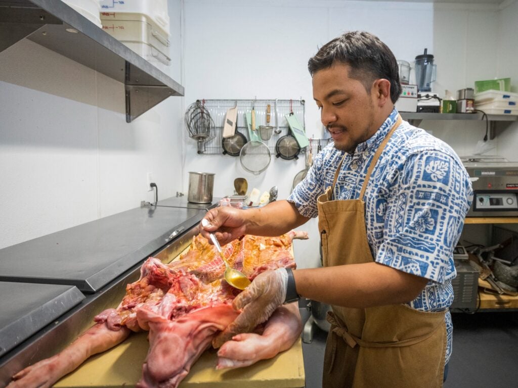 Prubechu co-owner, Chef Shawn Naputi, prepares for one of the restaurant’s fiesta celebrations