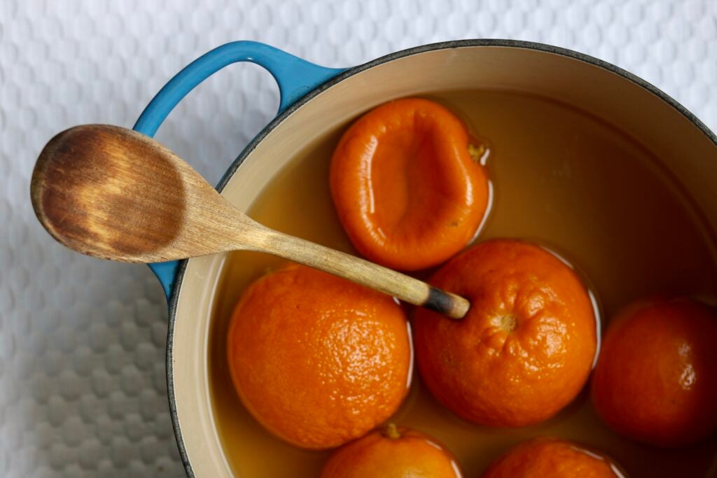 Simmering Seville oranges for marmalade