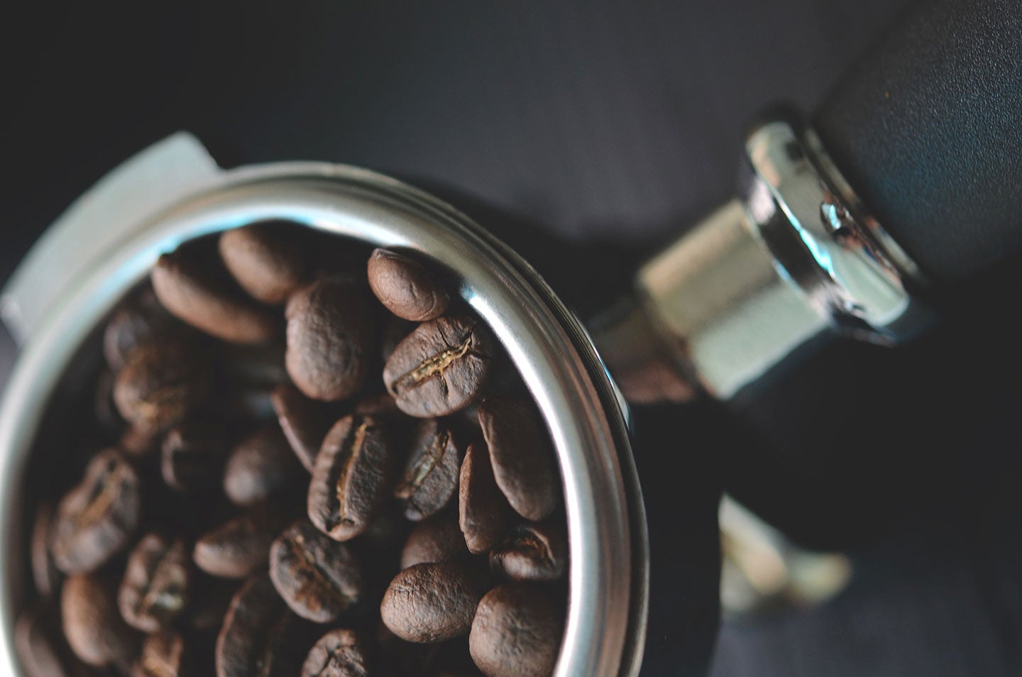 espresso beans packed into a portafilter