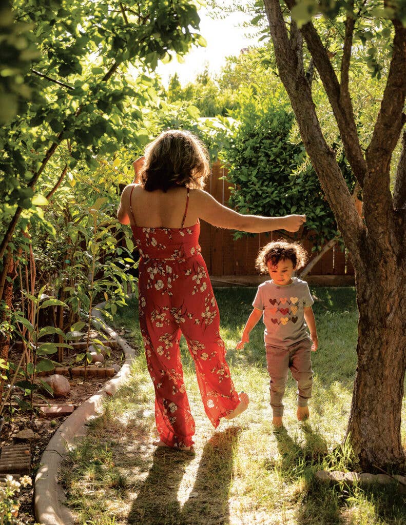 Chef Reem Assil dancing with her son.