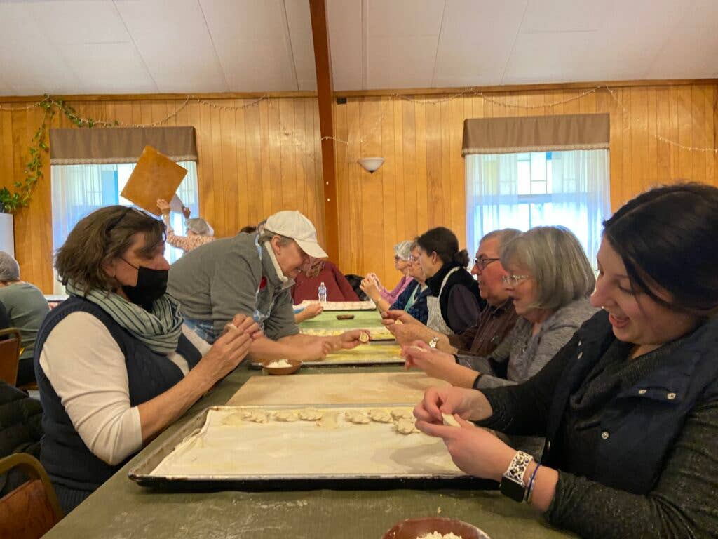 volunteers wrapping pierogies in church