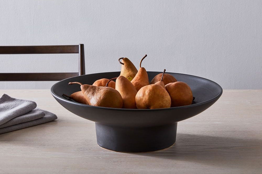 Fruit In A Bowl On The Marble Island In White Kitchen Stock Photo