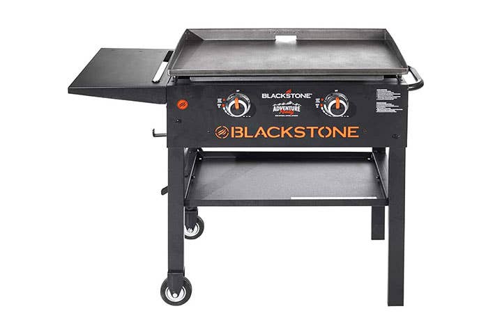 https://www.saveur.com/uploads/2022/06/29/best-flat-top-grills-Blackstone-Adventure-Ready-2-Burner-Outdoor-Griddle-saveur.jpg?auto=webp&auto=webp&optimize=high&quality=70&width=1440