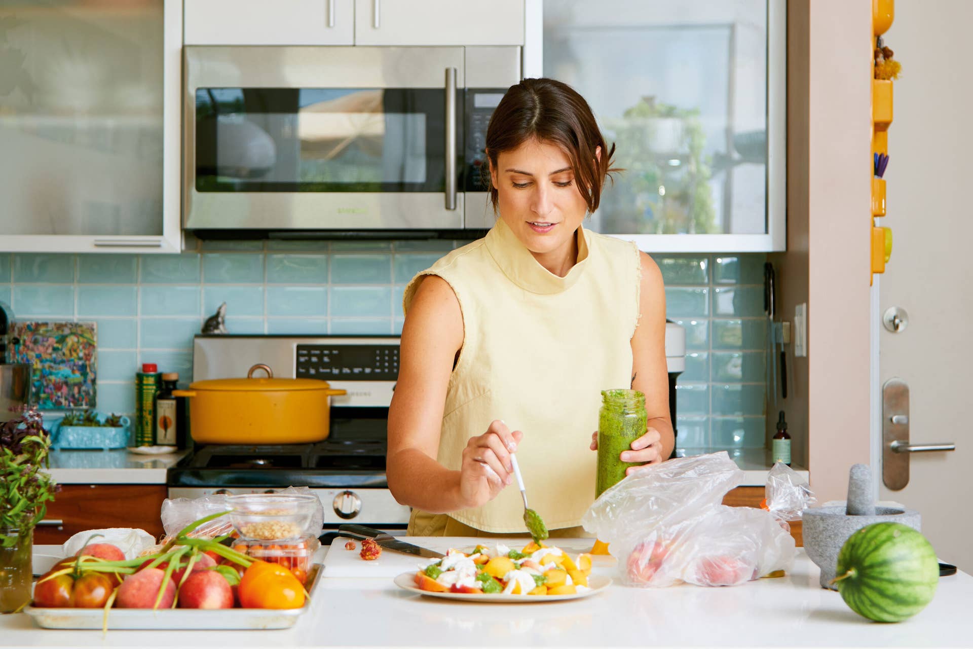 Smiling homemaker in kitchen