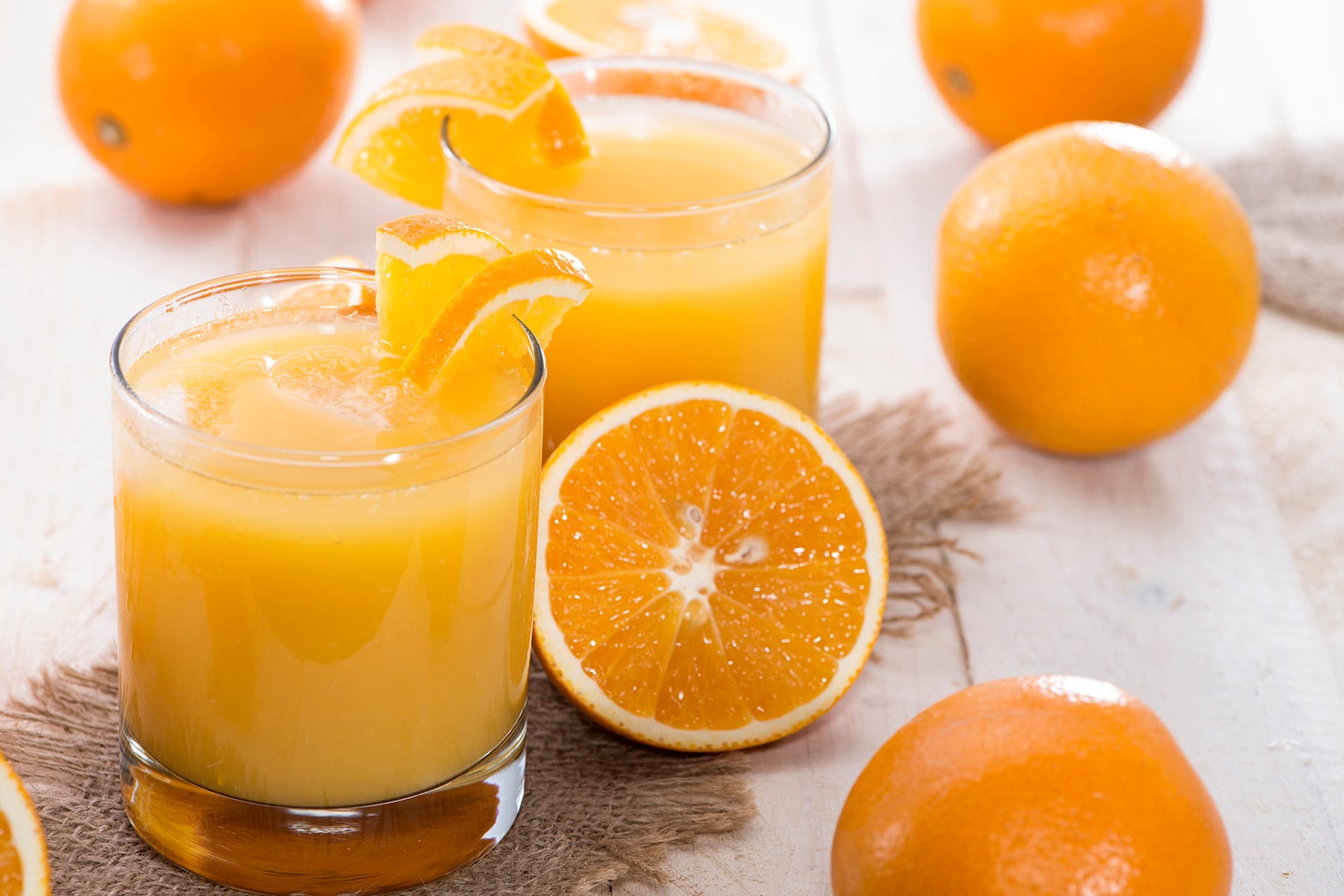 Portion of fresh made Orange Juice (with fruits)
