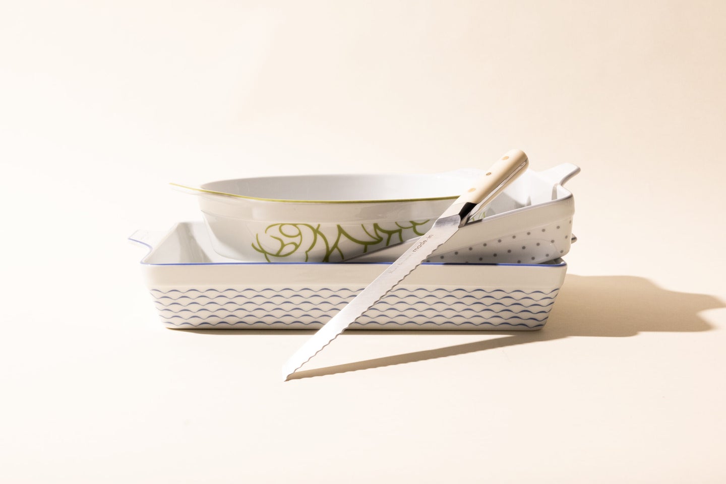 Made In x Nancy Silverton collection with three pieces of bakeware and a bread knife