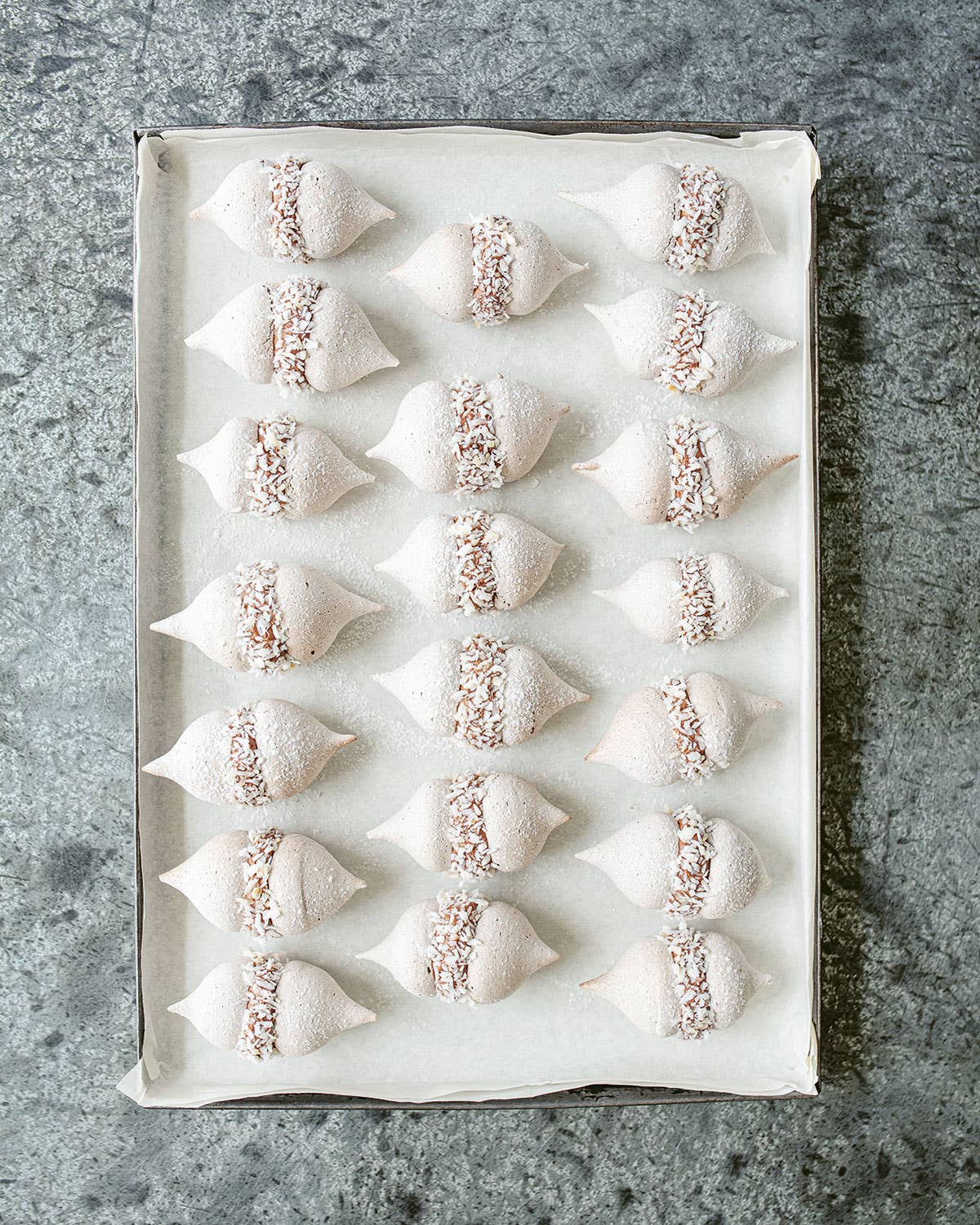 Baby Cocoa Meringues with Chocolate Cream and Candied Coconut