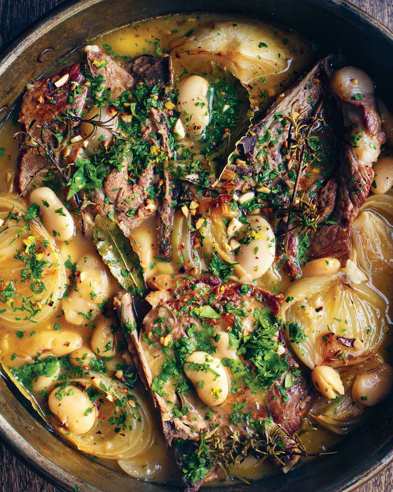 Brothy Sherried Pork Chops with Butter Beans and Almond Gremolata