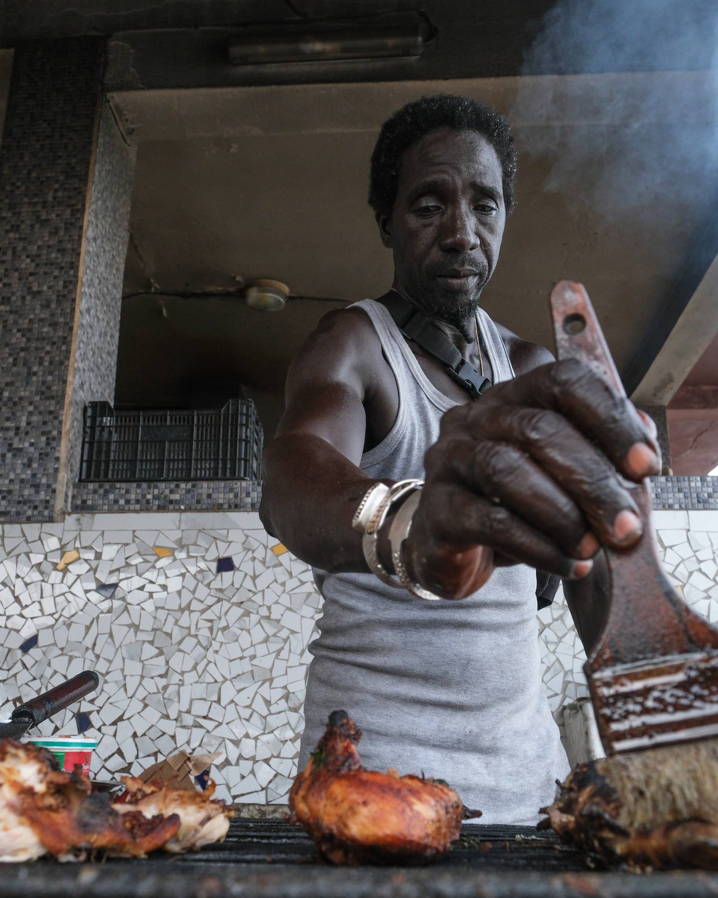 Where to Eat in Dakar, Senegal Grilling fish at Chez Seck in Dakar, Senegal