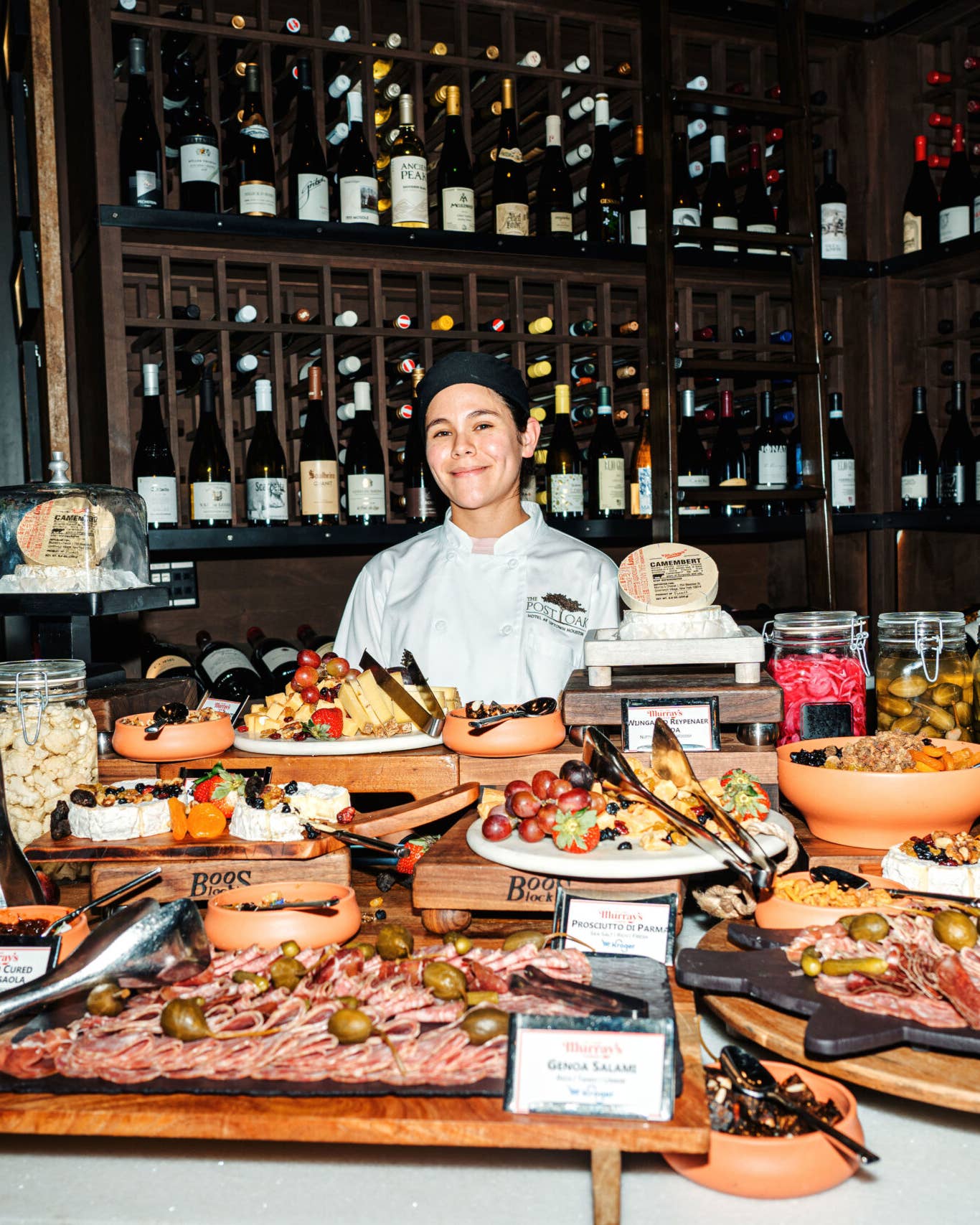 Toasting SAVEUR’s Latest Issue in Houston, a Culinary Destination on the Rise A chef stands behind an extravagant cheese and charcuterie grazing table in Stella's Wine Bar.