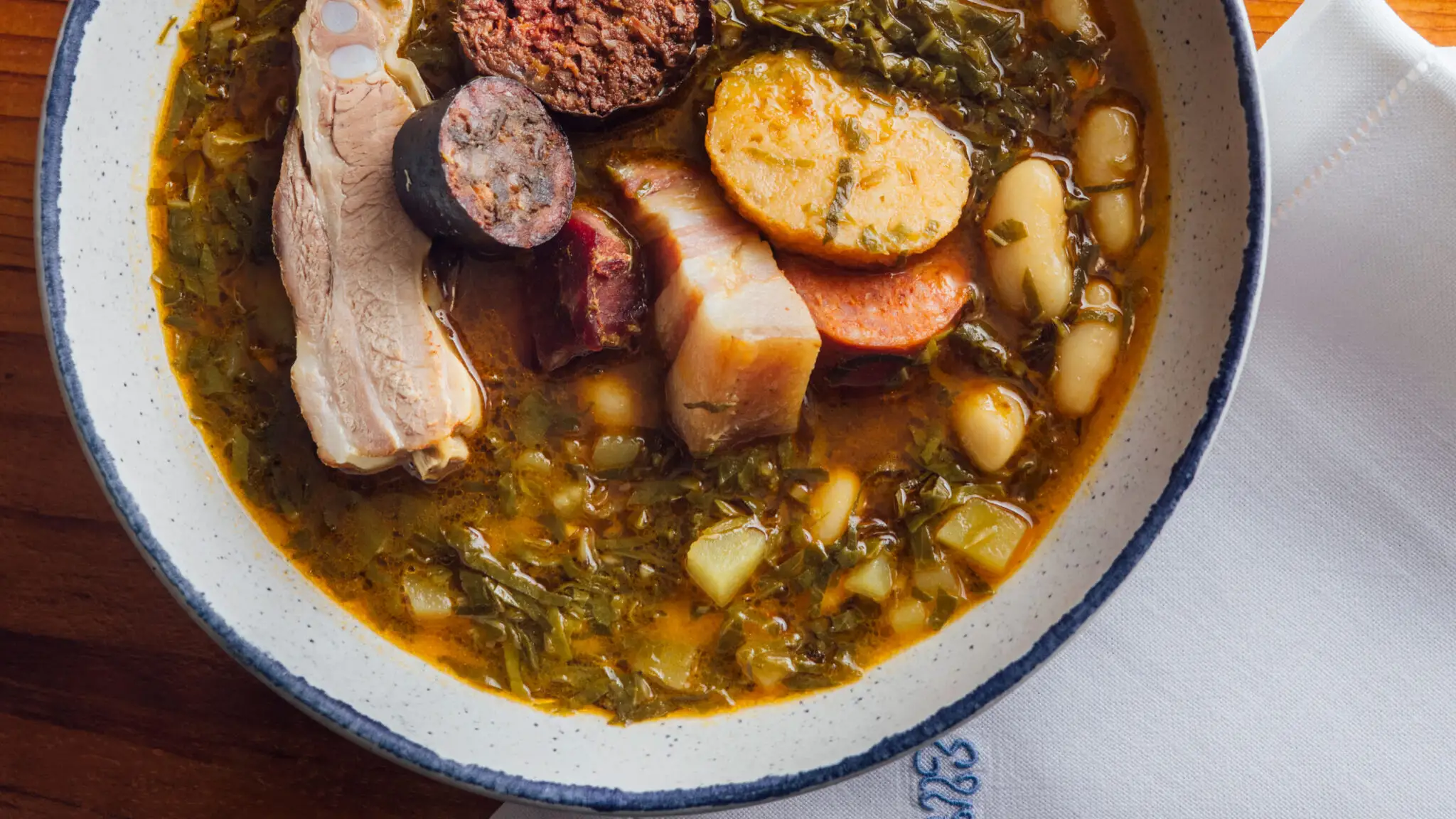 Pote de Berzas con Pantrucu (Pork Stew with Greens and Cornmeal Dumplings)-image