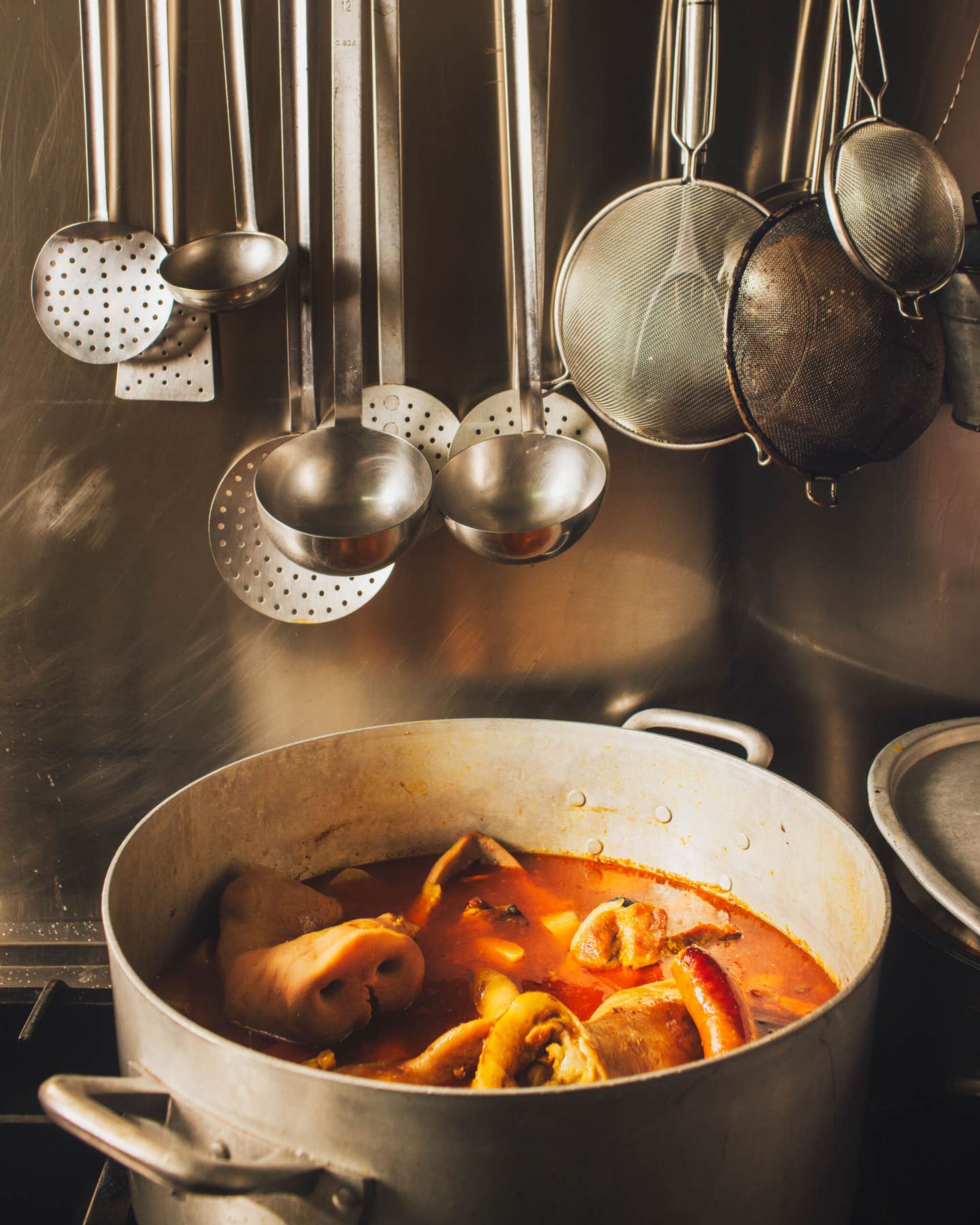 Pork stew simmers on the stove at Bar Camacho in Anieves. 