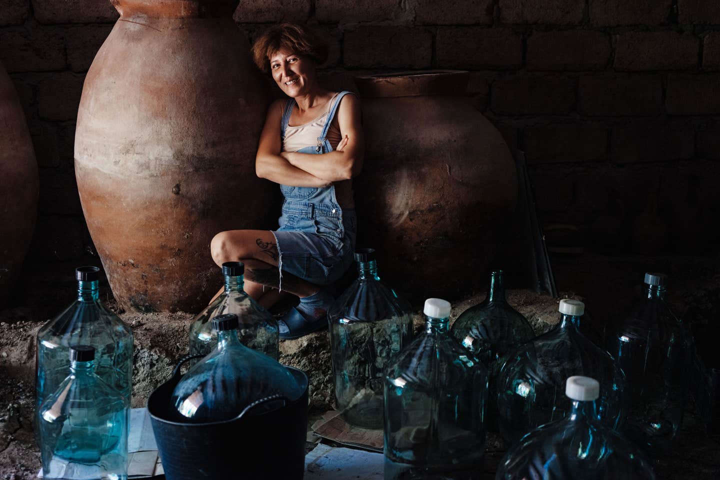 Natia Cheko poses beside a kvevri Natia Cheko poses beside a kvevri