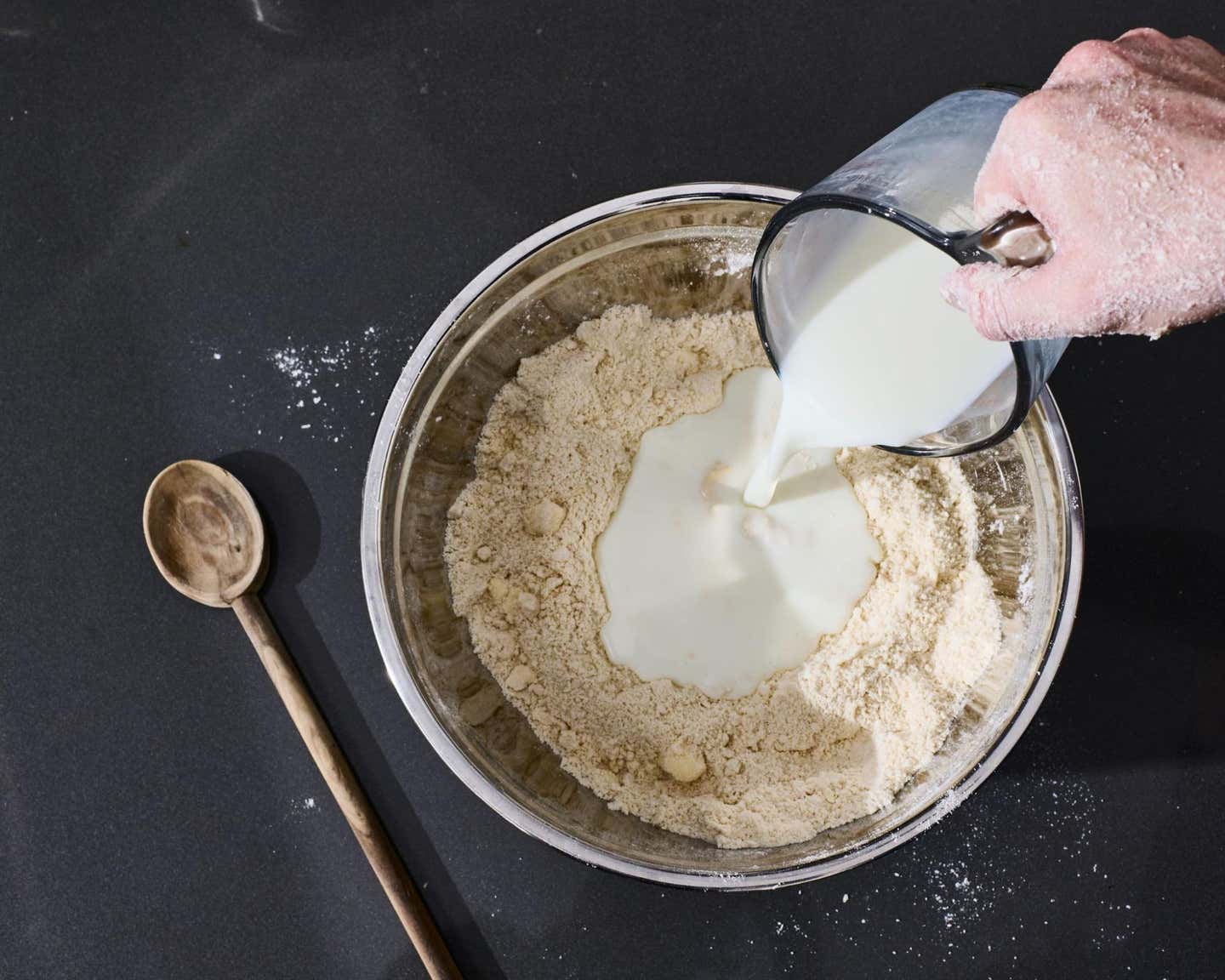 Adding the buttermilk and mix-ins. Adding the buttermilk and mix-ins.