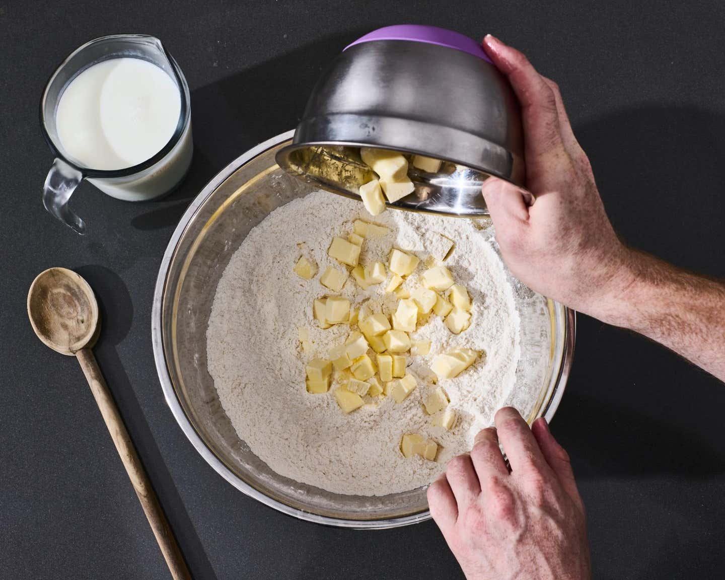 Adding butter into the bowl. Adding butter into the bowl.