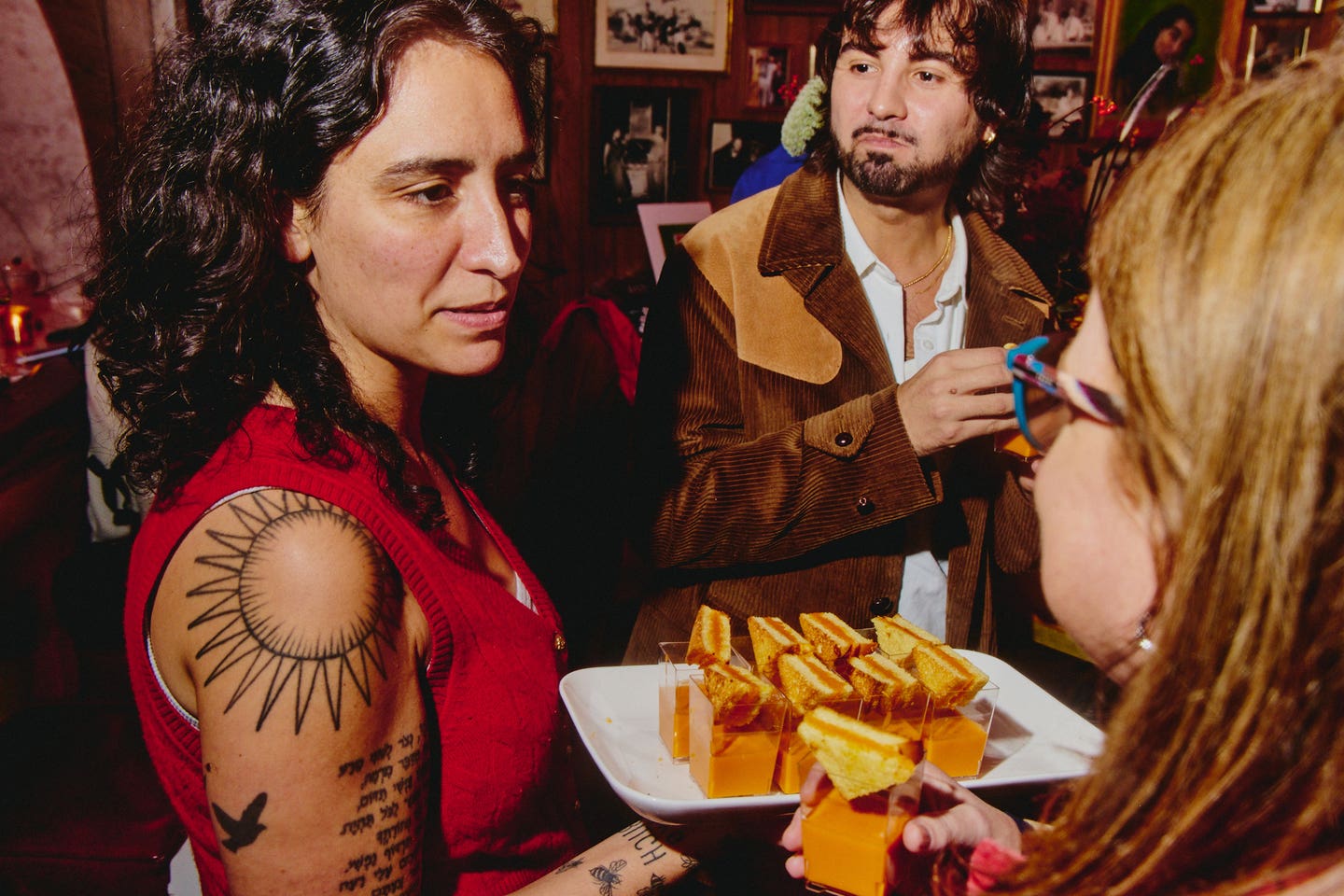 The Turk’s Inn general manager Alex Koones circulates grilled cheese and tomato soup shooters. 